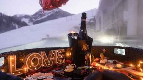 Picture gallery Romantic dinner with food, champagne, and LOVE lights in the mountains