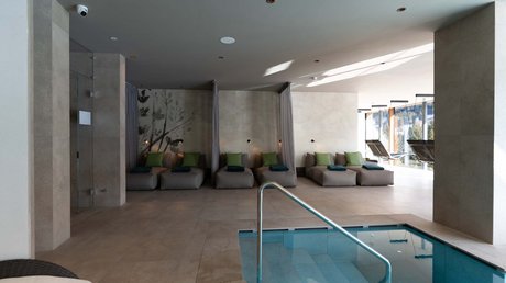 Picture gallery Relax area with loungers and indoor pool in a modern spa