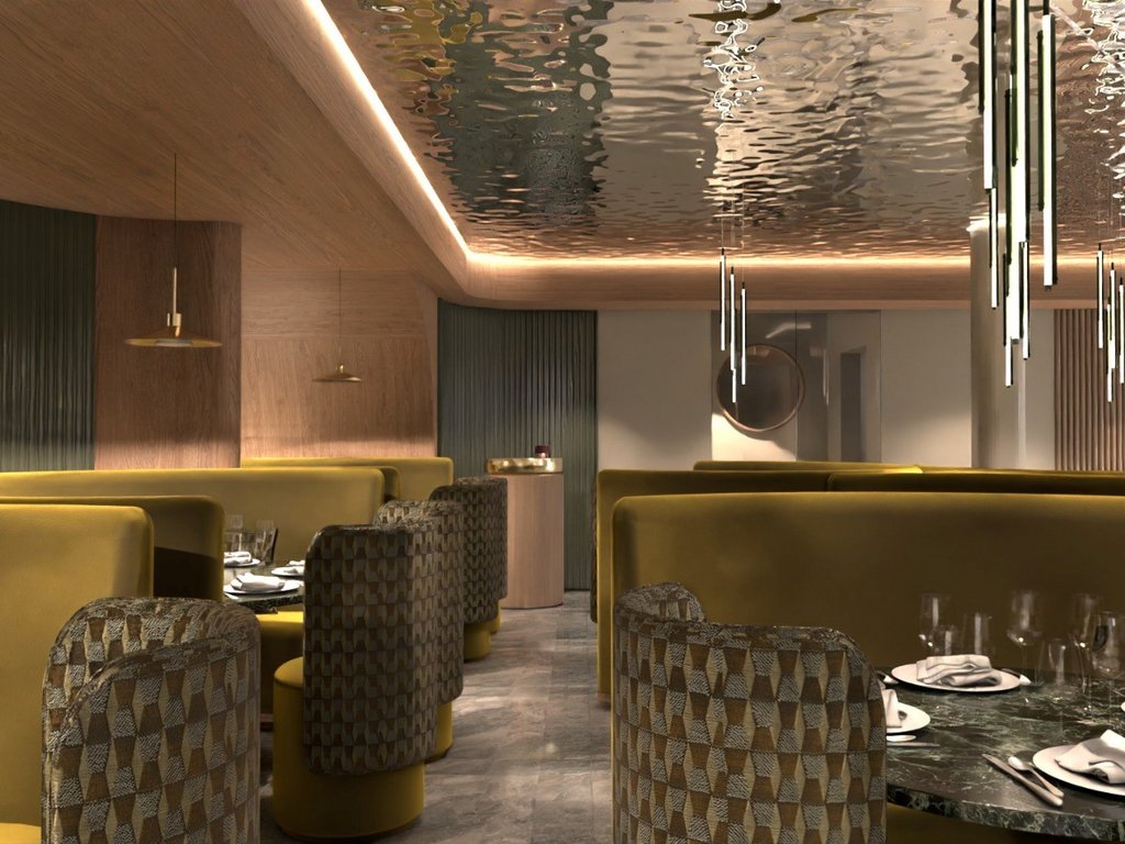 Ristorante gourmet in Val di Fassa: il Mirage al Latemar Interno di un ristorante elegante con sedute gialle e illuminazione moderna