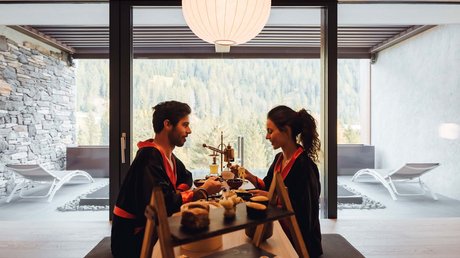 Picture gallery Couple eating sushi indoors with mountain view